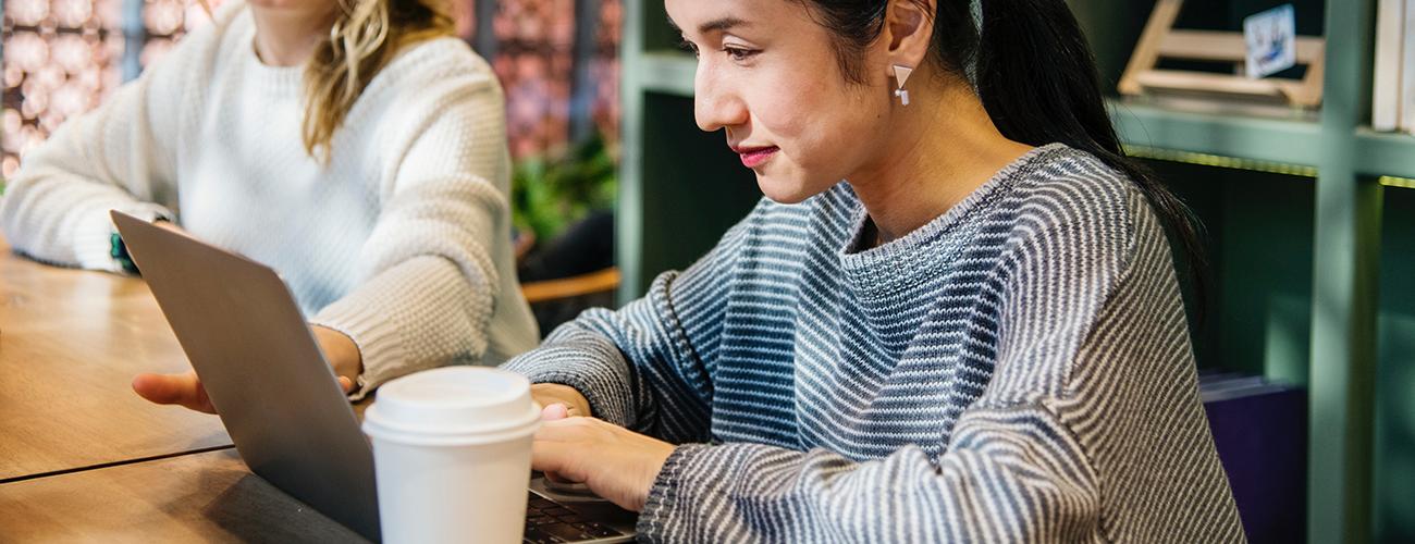 Woman looking on laptop